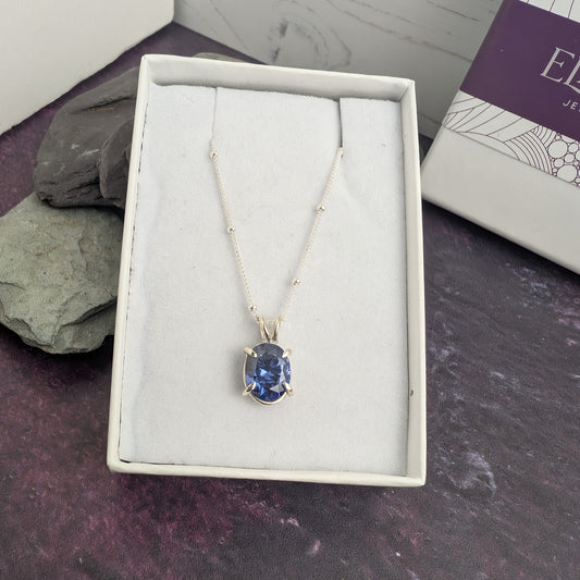 Claw set sparkle oval tanzanite necklace