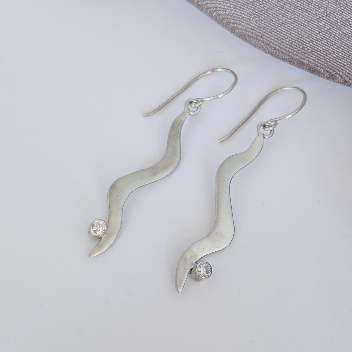 Silver and Moissanite wavy dangle earrings