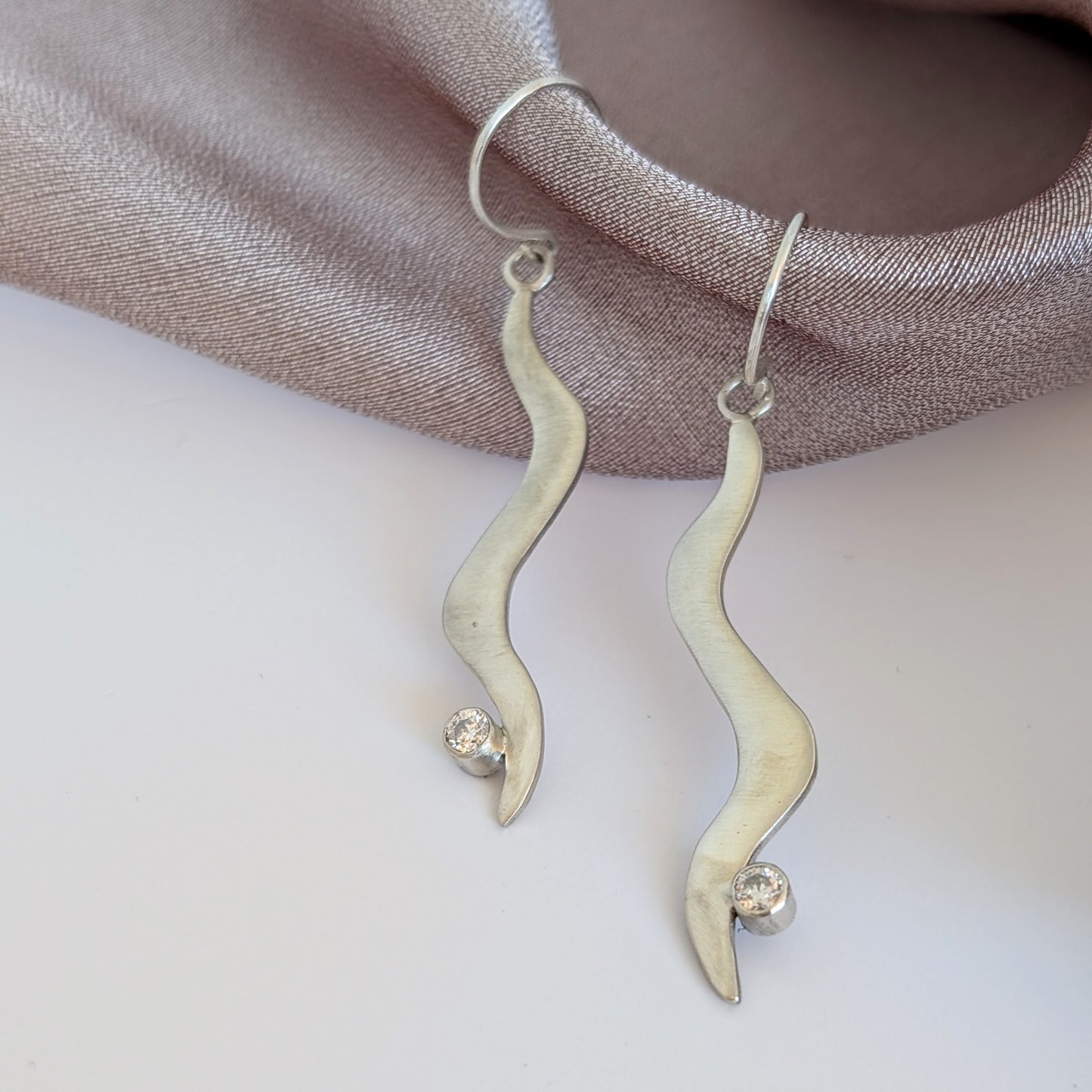 Silver and Moissanite wavy dangle earrings