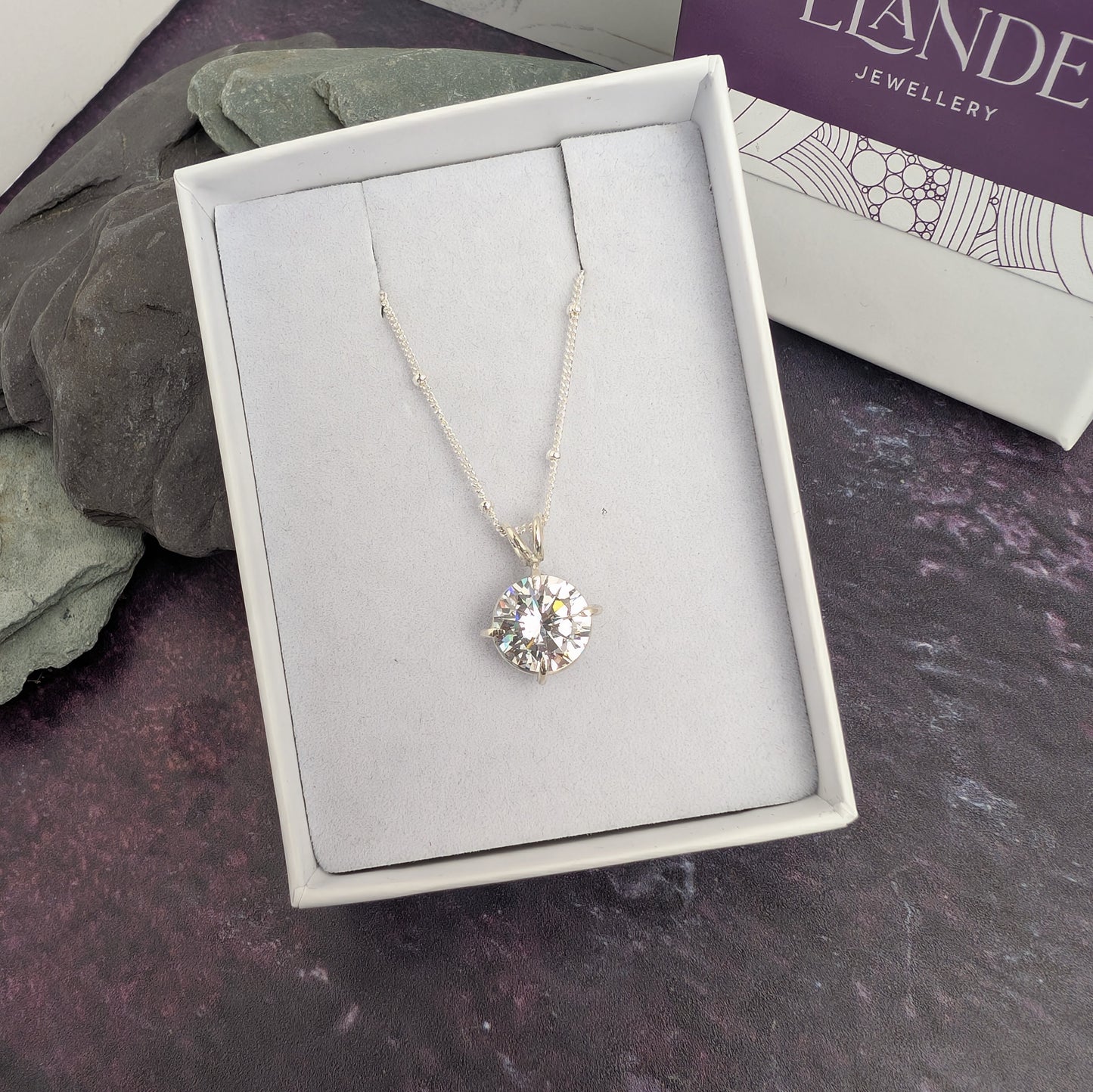 Claw set sparkle round stone necklace