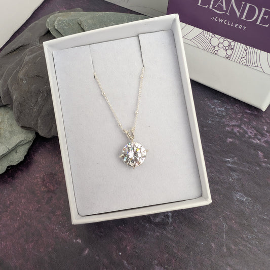 Claw set sparkle round stone necklace